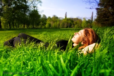 woman relaxing on lawn